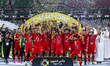 Al Arabi SC players are celebrating with the trophy after winning the Qatar-UAE Super Cup...