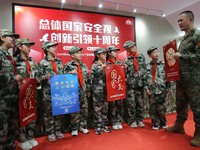 A military experience camp instructor is explaining national security knowledge to primary school students in Lianyungang, East China's Jian...