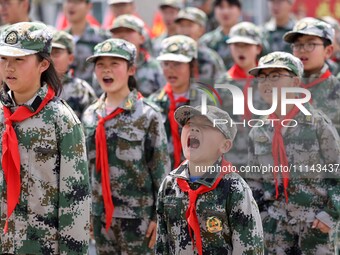 Primary school students are attending a military experience camp in Lianyungang, Jiangsu Province, China, on April 13, 2024. (