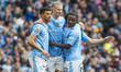 Erling Haaland, wearing the number 9 jersey for Manchester City, is celebrating his goal d...