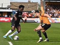 Tyreece Campbell of Charlton Athletic is being challenged by Danny Andrew of Cambridge United during the Sky Bet League 1 match at the Cleda...