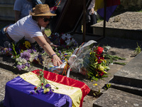 People are placing flowers in the crypt to honor the republican victims who were killed in the Francoist prison of Valdenoceda in Burgos, Sp...