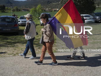 Women carrying a Republican flag are heading to the Valdenoceda cemetery in Burgos, Spain, to participate in a tribute to those who suffered...
