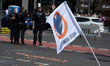 A flag of the Last Generation is being displayed while dozens of climate activists from th...