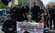 Dozens of climate activists from the Last Generation group are refusing to leave after pol...