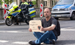A dozen climate activists from the Last Generation group are blocking the street of Koenig...