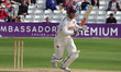 Simon Harmer of Essex is in action during day two of the Vitality County Championship - Di...