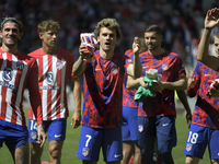 Atletico de Madrid players are celebrating their victory in the LaLiga EA Sports match against Girona FC at Civitas Metropolitano Stadium in...