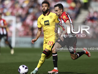 Sergio Reguilon of Brentford is on the ball during the Premier League match between Brentford and Sheffield United at the Gtech Community St...