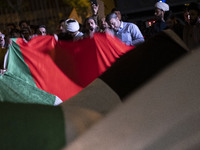 Iranians are waving a huge Palestinian flag and shouting anti-U.S. and anti-Israeli slogans in downtown Tehran, Iran, on April 14, 2024, cel...