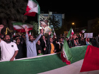 Iranians are shouting anti-U.S. and anti-Israeli slogans while celebrating Iran's IRGC UAV and missile attack against Israel in downtown Teh...