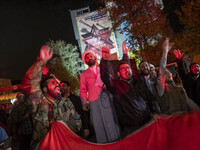 Iranian men are shouting anti-U.S. and anti-Israeli slogans while celebrating Iran's IRGC UAV and missile attack against Israel in downtown...