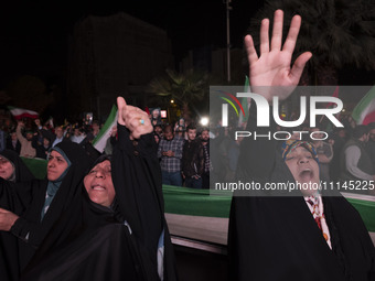 Two veiled Iranian women are shouting anti-U.S. and anti-Israeli slogans while celebrating Iran's IRGC UAV and missile attack against Israel...