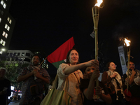 Social organizations are lighting torches while demonstrating outside the Palace of Fine Arts in Mexico City, in solidarity with Palestine a...