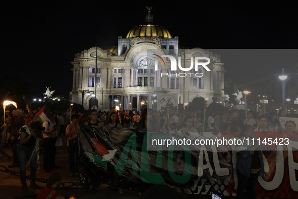 A person is demonstrating outside the Palace of Fine Arts in Mexico City, Mexico, on October 7, 2023, amid the escalation in the Middle East...