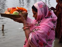 Devotees are worshipping the sun God on the banks of the Brahmaputra River during the Chaiti Chhath Puja festival in Guwahati, India, on Apr...