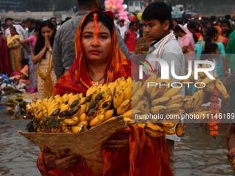 Devotees are worshipping the sun God on the banks of the Brahmaputra River during the Chaiti Chhath Puja festival in Guwahati, India, on Apr...
