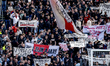 Supporters of Ajax are holding banners reading ''Praag out'' during the match between Ajax...