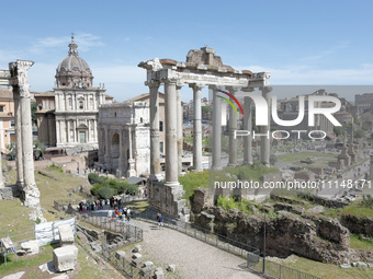 A general view is being shown of (L-R) the church of Santi Luca e Martina, the Arch of Septimius Severus, the ruins of the Temple of Saturn,...