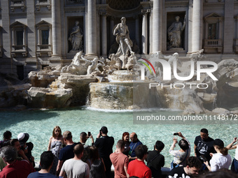 Tourists are visiting the Trevi Fountain in Rome, Italy, on April 14, 2024. (