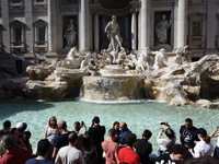 Tourists are visiting the Trevi Fountain in Rome, Italy, on April 14, 2024. (