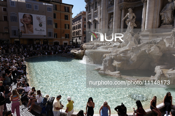 Tourists are visiting the Trevi Fountain in Rome, Italy, on April 14, 2024. 