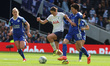 Grace Clinton, on loan from Manchester United, is holding off Saori Takarada of Leicester...
