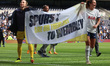 Barbora Votkova and Ramona Petzelberger of Tottenham Hotspur Women are posing with a banne...