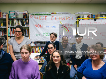 Several dozen parents, children, and staff are occupying the public school for the night at the College d'Echange contre le choc des savoirs...
