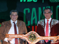 President of the World Boxing Council (WBC), Mauricio Sulaiman (L), accompanied by the Governor of Tamaulipas, Americo Villareal, is showing...