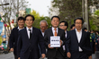 Lee Kyu-jung (center), General Secretary of the Korean Liberation Association, is deliveri...
