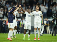 Vinicius Junior left winger of Real Madrid and Brazil and Joselu centre-forward of Real Madrid and Spain celebrate victory after the UEFA Wo...