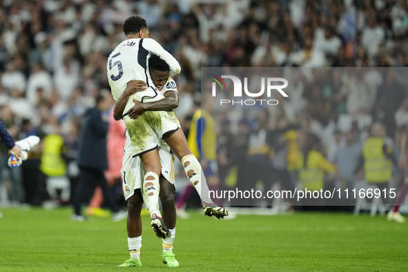 Vinicius Junior left winger of Real Madrid and Brazil and Jude Bellingham central midfield of Real Madrid and England celebrates victory aft...