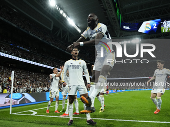 Jude Bellingham central midfield of Real Madrid and England celebrates with Antonio Rudiger centre-back of Real Madrid and Germany after sco...
