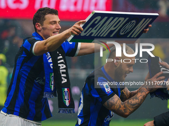Benjamin Pavard and Federico Dimarco are celebrating during the AC Milan versus FC Internazionale match in Serie A at Giuseppe Meazza Stadiu...