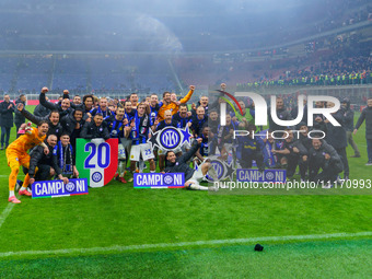 The FC Inter team is celebrating their championship during the match against AC Milan in the Serie A at Giuseppe Meazza Stadium in Milan, It...