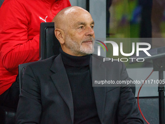 Stefano Pioli, the head coach of AC Milan, is watching the game between AC Milan and FC Internazionale in the Serie A at Giuseppe Meazza Sta...