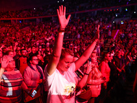 Faithful react during Franklin Graham 'God Loves You' tour in Tauron Arena in Krakow, Poland on April 11, 2024.  (