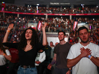 Faithful react during Franklin Graham 'God Loves You' tour in Tauron Arena in Krakow, Poland on April 11, 2024.  (
