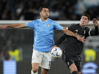 Nicolo Casale of S.S. Lazio is competing for the ball with Dusan Vlahovic of Juventus FC during the Coppa Italia Semi-final Second Leg match...