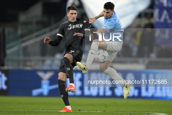 Alessio Romagnoli of S.S. Lazio is competing for the ball with Dusan Vlahovic of Juventus FC during the Coppa Italia Semi-final Second Leg m...