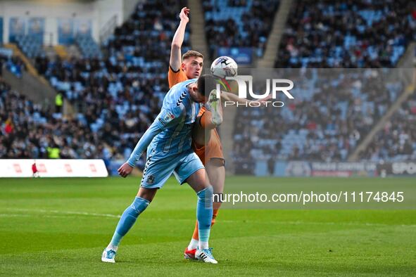 Bobby Thomas of Coventry City is being challenged by Liam Delap of Hull City during the Sky Bet Championship match at the Coventry Building...