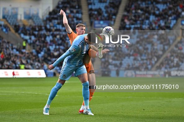 Bobby Thomas of Coventry City is being challenged by Liam Delap of Hull City during the Sky Bet Championship match between Coventry City and...
