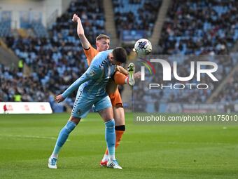 Bobby Thomas of Coventry City is being challenged by Liam Delap of Hull City during the Sky Bet Championship match between Coventry City and...