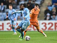 Kasey Palmer of Coventry City is being challenged by Alfie Jones of Hull City during the Sky Bet Championship match at the Coventry Building...