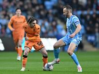 Abdulkadir Omur of Hull City is being challenged by Liam Kelly of Coventry City during the Sky Bet Championship match at the Coventry Buildi...