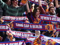 FC Barcelona supporters are cheering during the match between FC Barcelona and Olympiacos Piraeus for the first game of the Play-off of the...