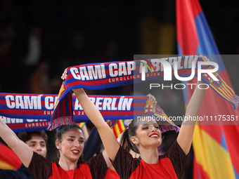 FC Barcelona cheerleaders are cheering during the match between FC Barcelona and Olympiacos Piraeus for the first game of the Play-off of th...