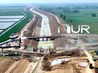 Workers are reinforcing beaches and embankments in Suqian, Jiangsu Province, China, on April 25, 2024. (
