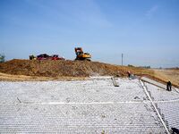 Workers are reinforcing beaches and embankments in Suqian, Jiangsu Province, China, on April 25, 2024. (